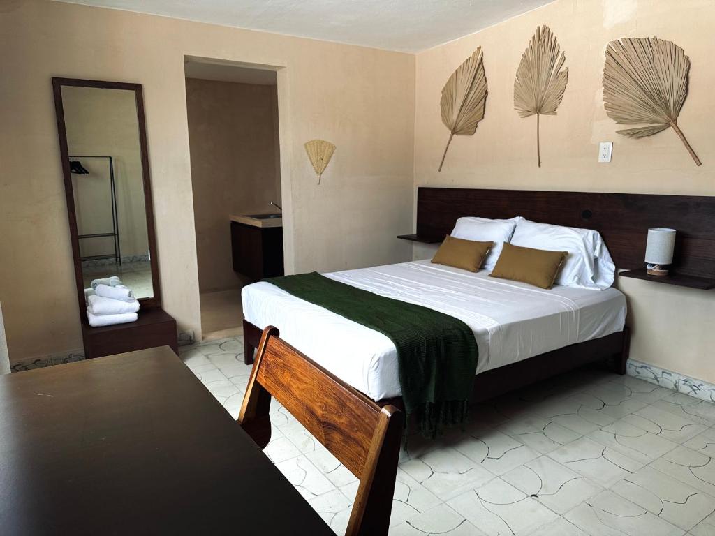 Ένα ή περισσότερα κρεβάτια σε δωμάτιο στο Hotel Casa Nudo, Parota, Mérida