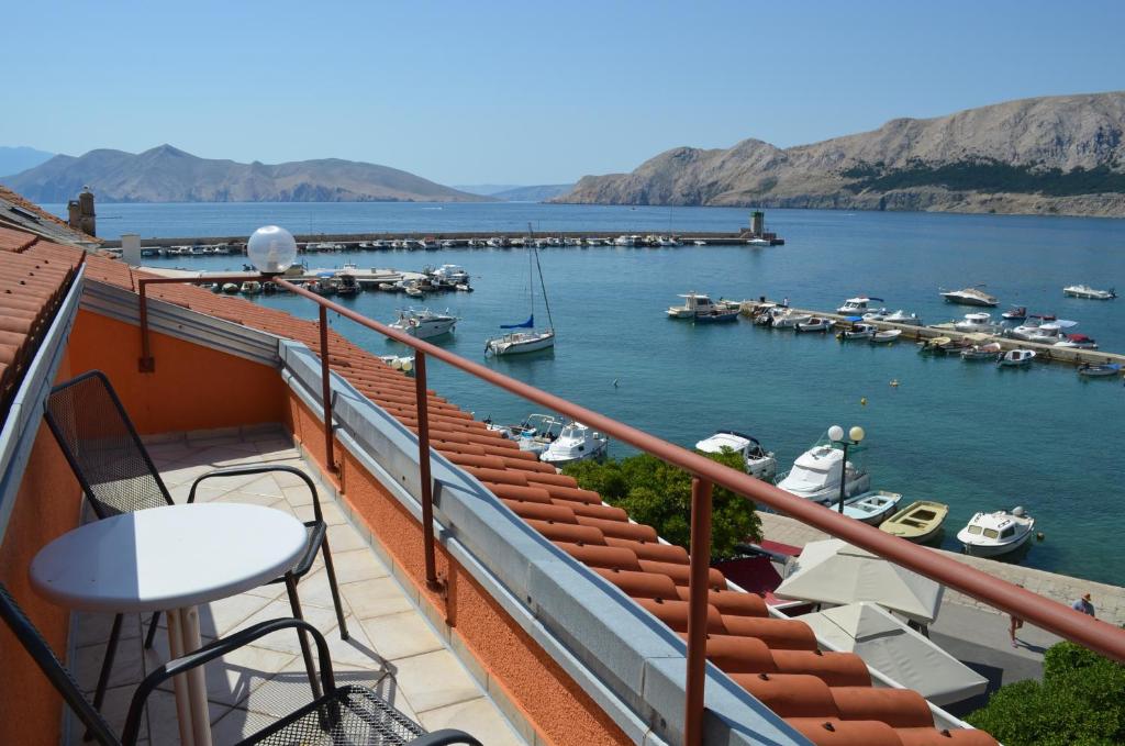 a balcony with a view of a marina at Apartment Borna in Baška