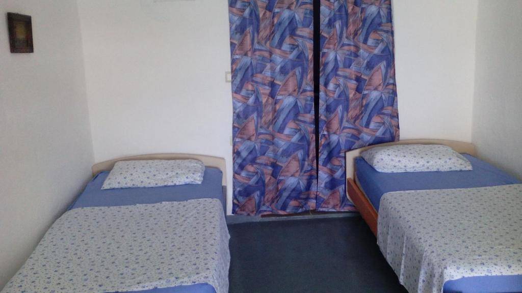 Postel nebo postele na pokoji v ubytování Stone House