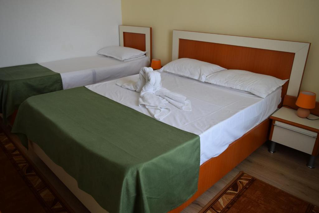 Postel nebo postele na pokoji v ubytování Hotel Cometa