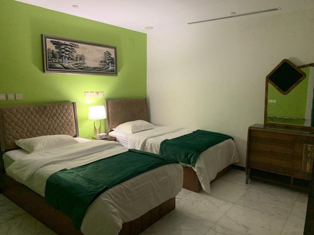 Ένα ή περισσότερα κρεβάτια σε δωμάτιο στο West Coast Chalet 2