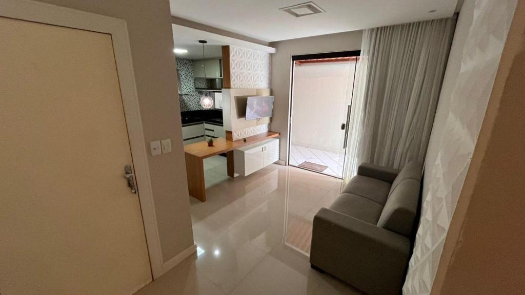 Μια τηλεόραση ή/και κέντρο ψυχαγωγίας στο Apartamento Praia do morro 350mt da praia 2 quartos