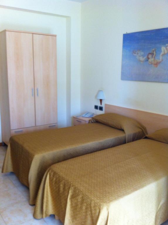 Postel nebo postele na pokoji v ubytování Hotel Atleti