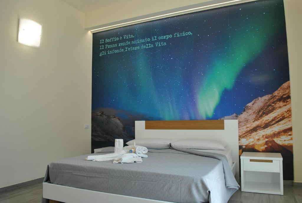 Postel nebo postele na pokoji v ubytování La Giara Guest House