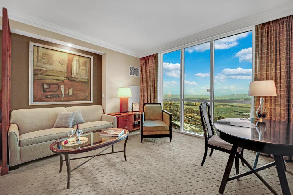a living room with a couch and a table at Sakura Serenity-View-No Resort Fee in Las Vegas