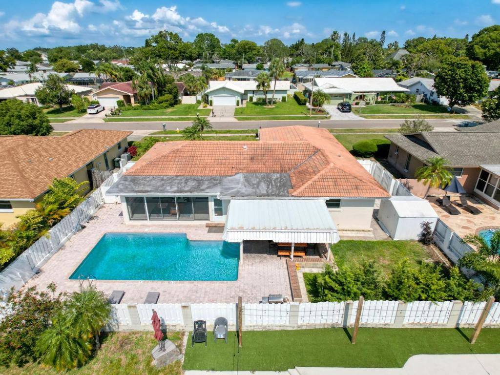 an aerial view of a house with a swimming pool at 2631 Cedarglen Drive in Dunedin