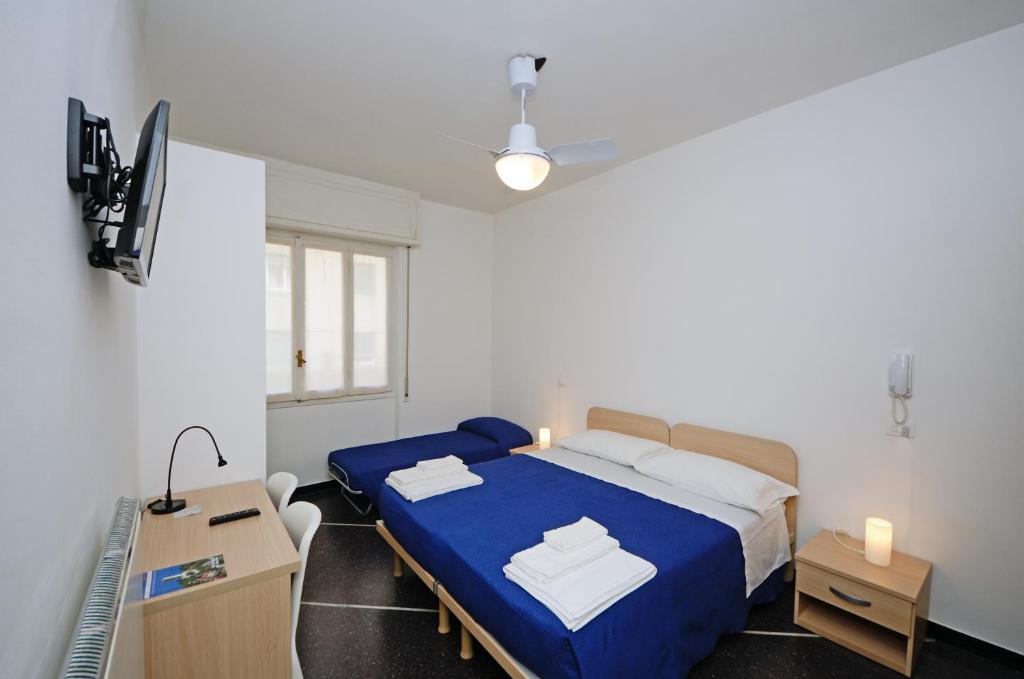 Łóżko lub łóżka w pokoju w obiekcie Locanda Marita