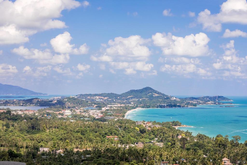 a view of a city and the ocean at Villa Sea Esta Luxury Residence at Chaweng Noi in Koh Samui 