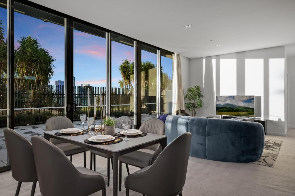 a dining room with a table and chairs at Opulent Harbourside Sanctuary in Melbourne