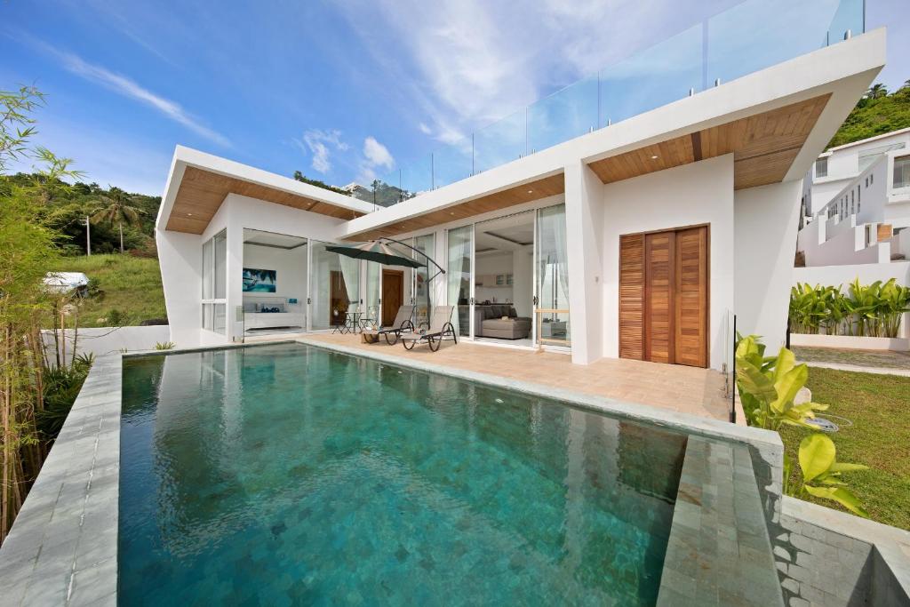 a swimming pool in the backyard of a house at Villa Namo Chaweng 2 Bed Garden Pool in Koh Samui
