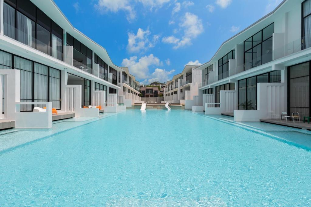 an empty swimming pool in the middle of a building at Pool Access Spacious Townhouse and Kids Slide in Koh Samui