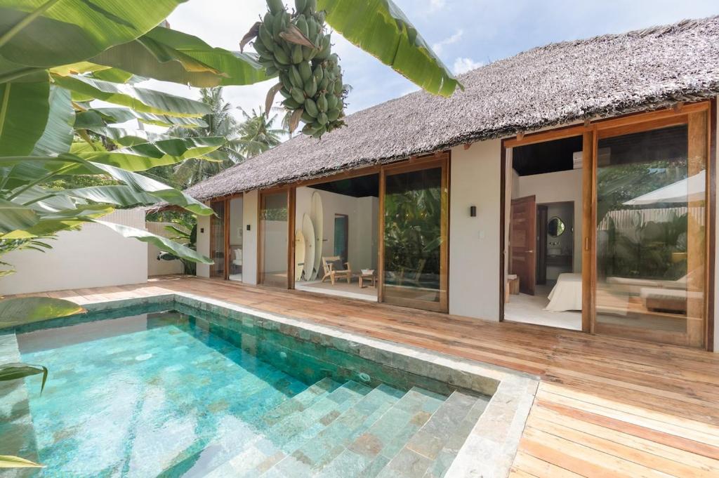 a villa with a swimming pool and a house at Villa Veloso A Private Villa with Pool in Sta Fe Siargao in General Luna