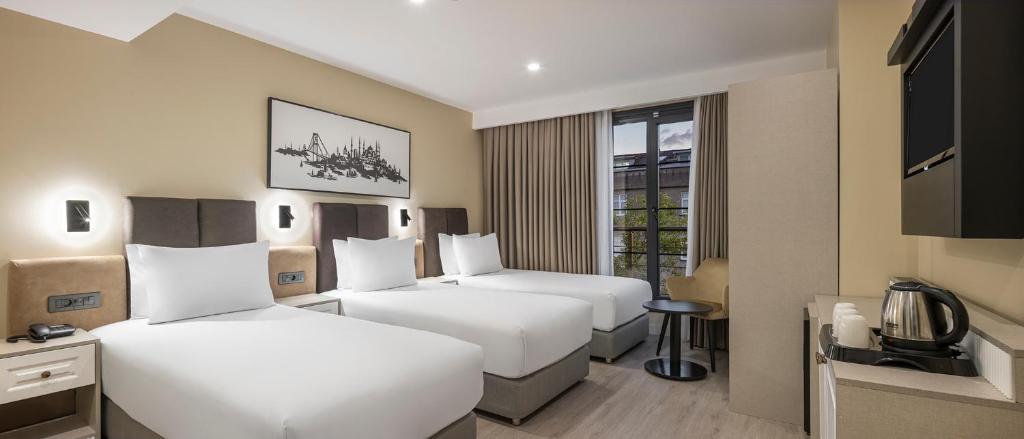 Ένα ή περισσότερα κρεβάτια σε δωμάτιο στο Garner Hotel Istanbul - Airport Arnavutkoy by IHG
