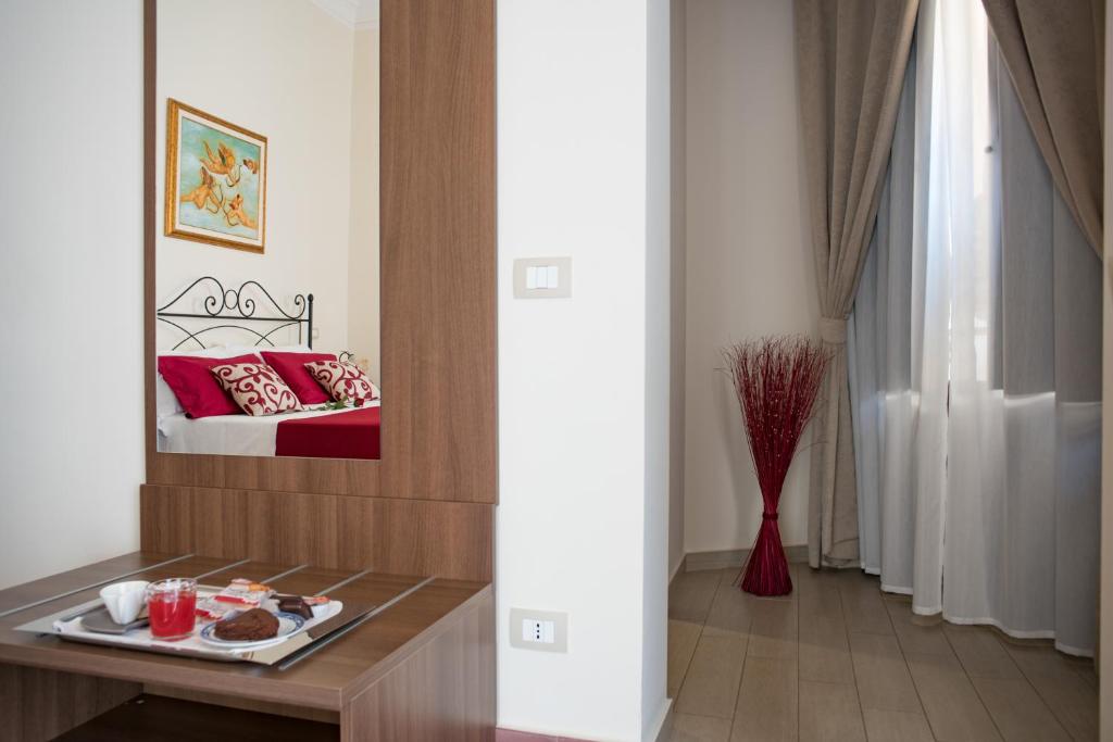 Posteľ alebo postele v izbe v ubytovaní B&B Palazzo Tornabene