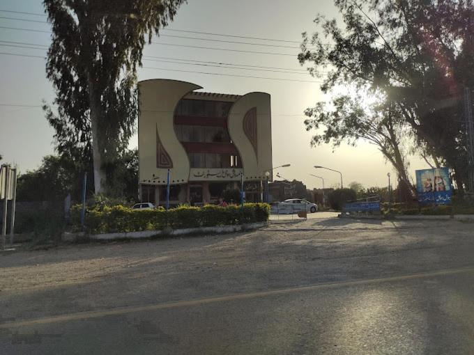a large building on the side of a road at Al-Rahman Hotel in Dargai
