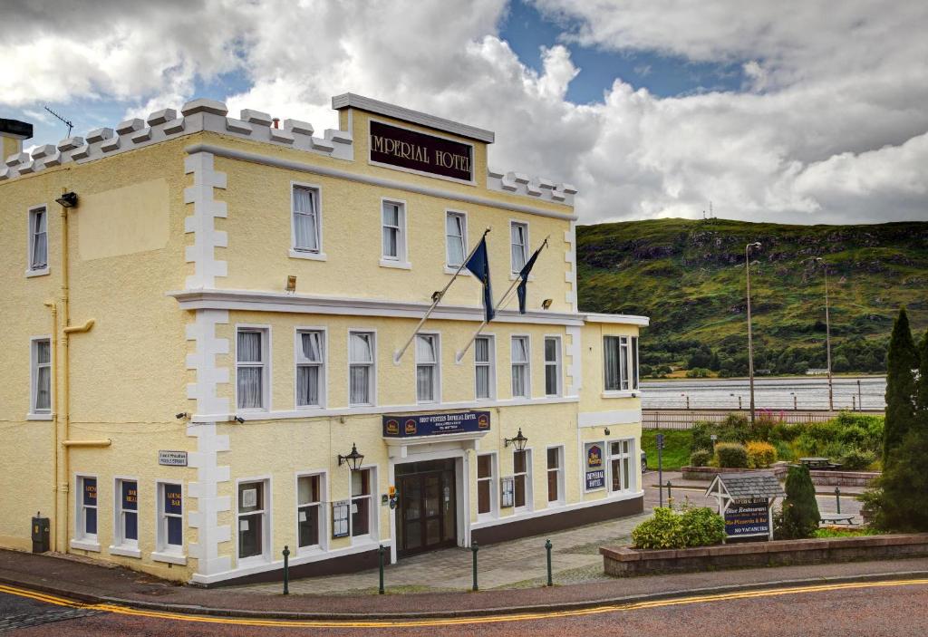 a large building with a clock on the side of it at The Imperial Hotel in Fort William