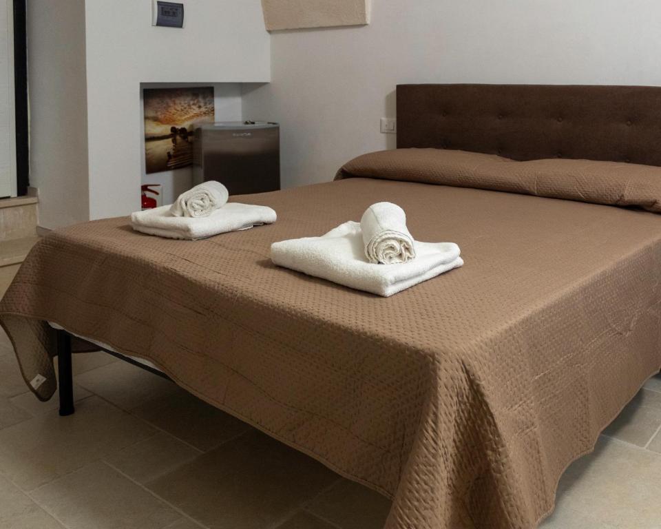 Postel nebo postele na pokoji v ubytování Lanucara 5