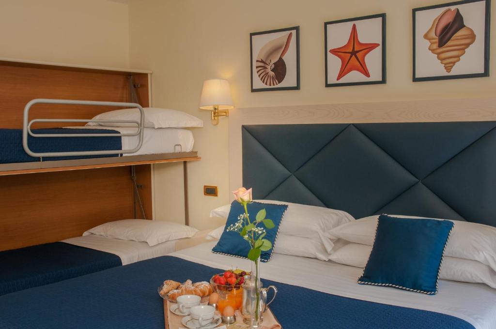 Postel nebo postele na pokoji v ubytování Hotel Del Mare