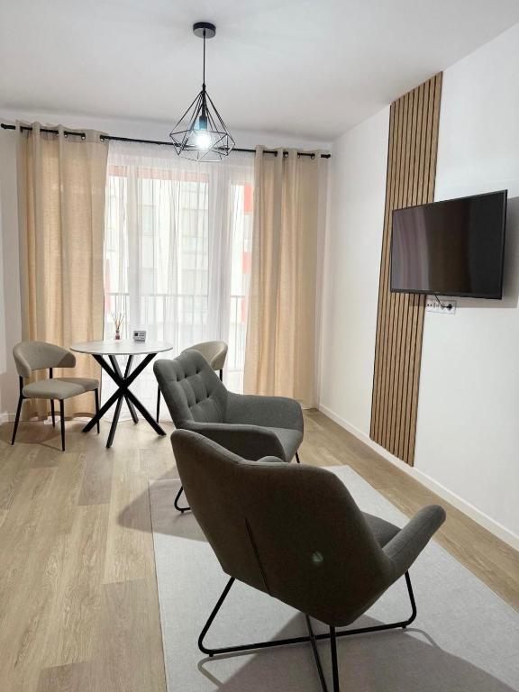 TV a/nebo společenská místnost v ubytování Apartament Abatorului Cluj-Floresti