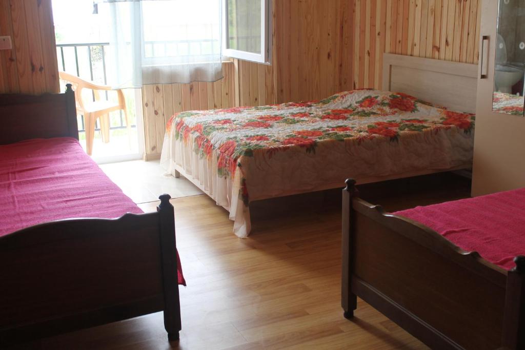 Postel nebo postele na pokoji v ubytování Guest House Mari