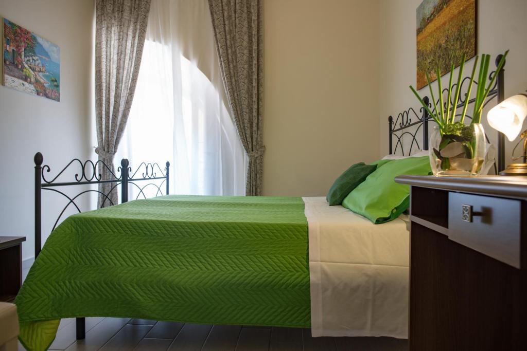 Posteľ alebo postele v izbe v ubytovaní B&B Palazzo Tornabene