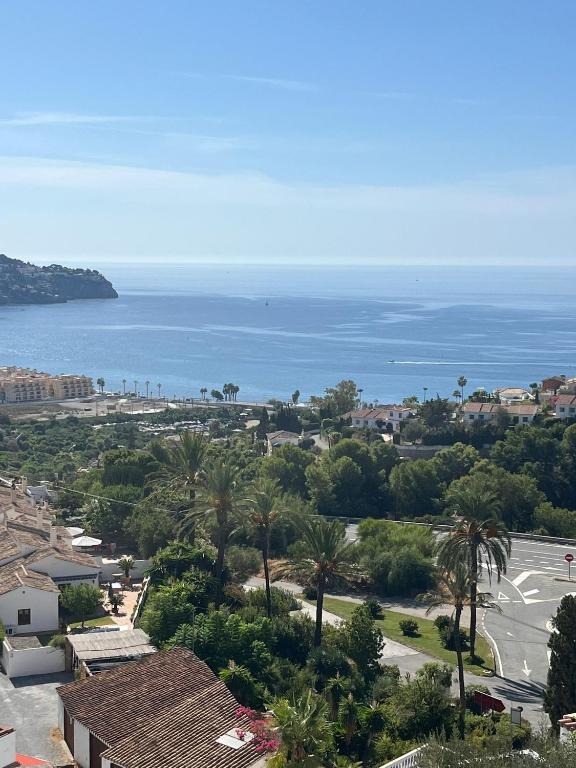 a view of the ocean from a building at La Ladera Bay View in La Herradura
