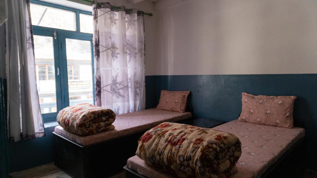 Postel nebo postele na pokoji v ubytování Hotel Sakura