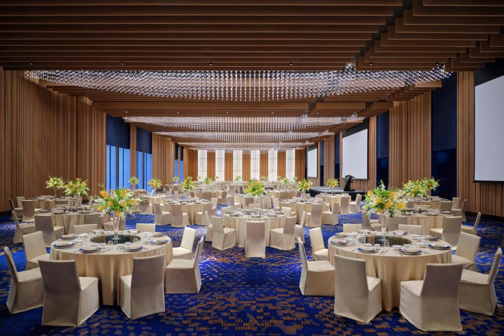 A formal banquet room is arranged for a large seated event.