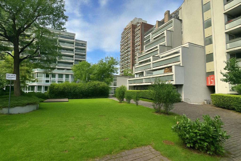 a green yard in front of a building at Eastside Karlsruhe in Karlsruhe