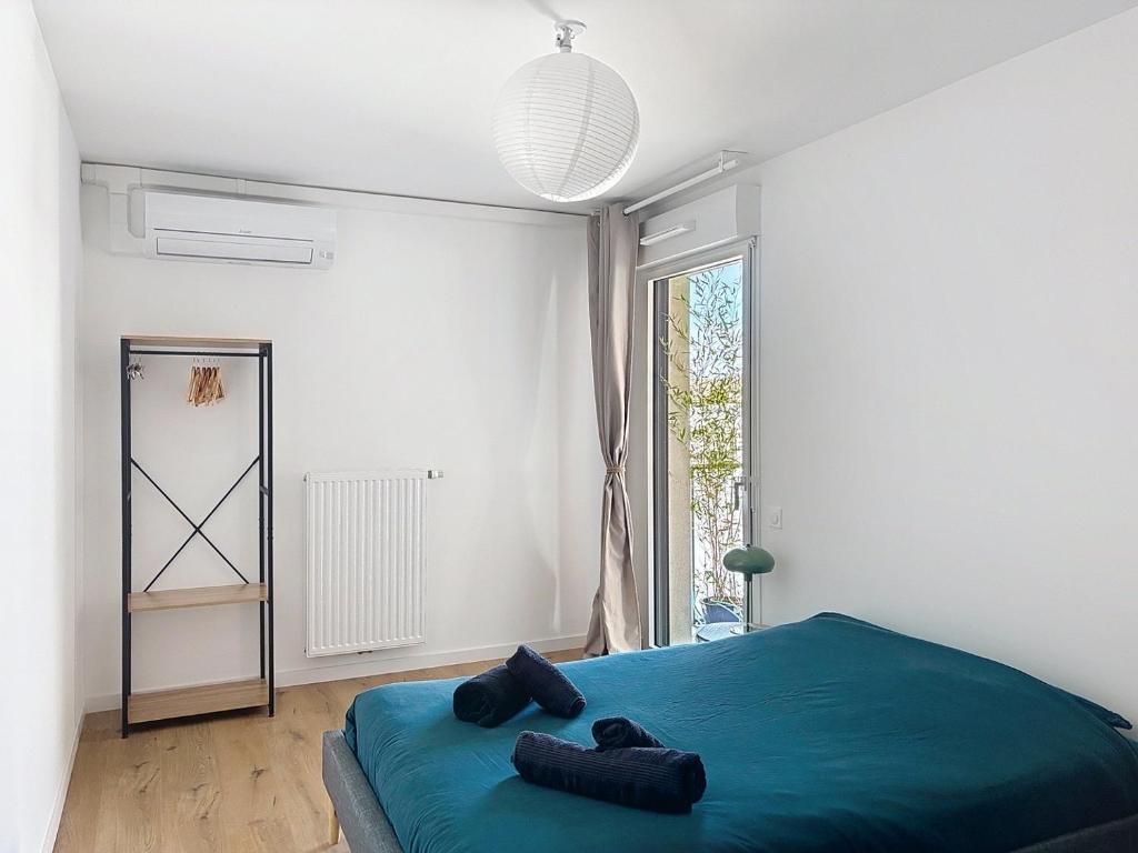 Ένα ή περισσότερα κρεβάτια σε δωμάτιο στο T3 avec loggia, Clim et parking - Proche Montpellier