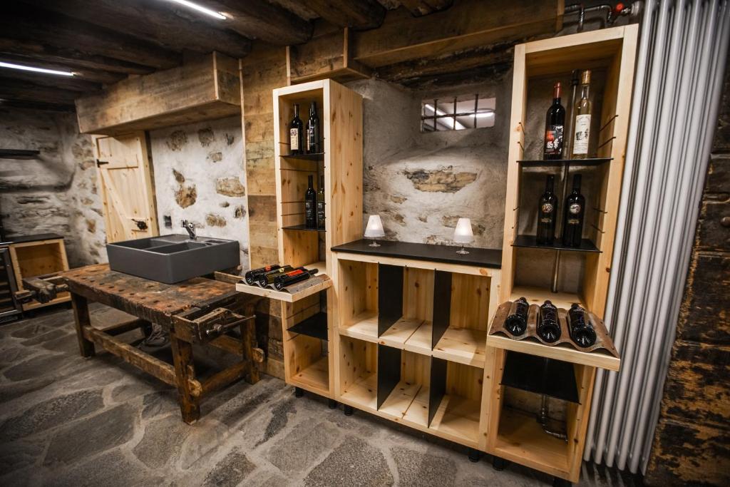 a wine tasting room with a sink and a table at B&B Zum Schleif in Varen