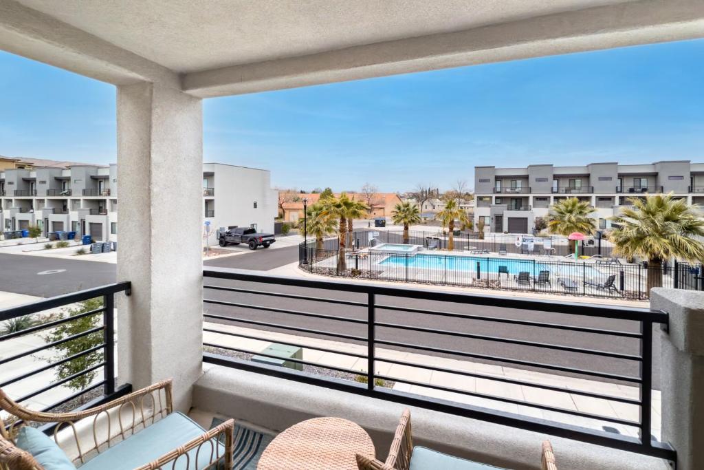 a balcony with a view of a pool and buildings at Luxury Stay at The Vue in Saint George Municipal Airport