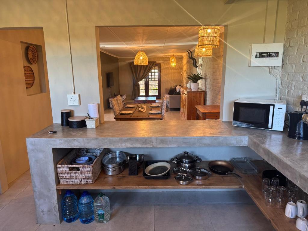 a kitchen with a counter top with a stove at The Pecan Cottage in Somerset East
