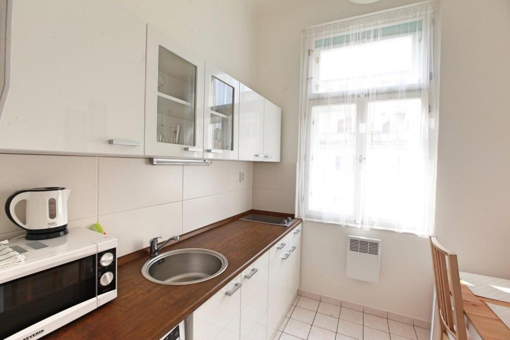 Kuchyň nebo kuchyňský kout v ubytování Angel City Aparthotel