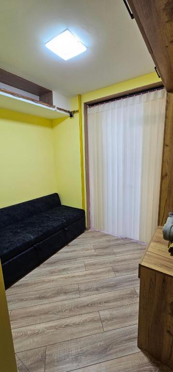 a room with a bed and a sliding door at Sayram in Yunusobod