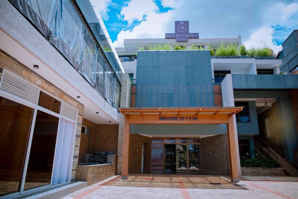 a building with a sign that reads harvard tods at Royal Crown Hotel - Kigali in Kigali