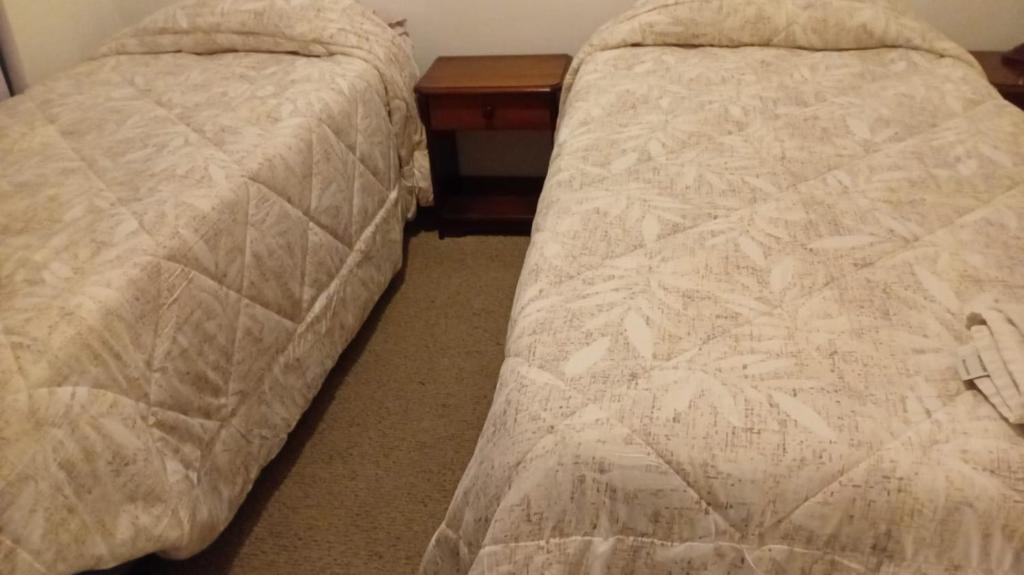 Departamento hotel quitorにあるベッド
