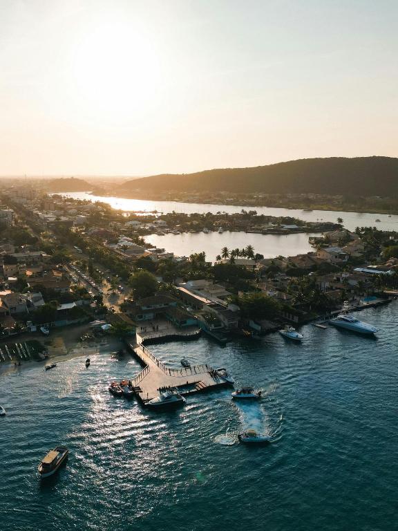 an aerial view of a harbor with boats in the water at Flat in 4-star hotel with panoramic pool in Cabo Frio