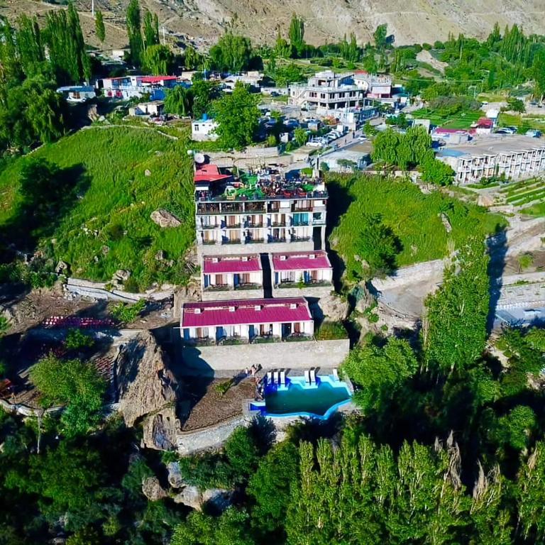 an aerial view of a resort on a hill at Hunza Hard Rock Resort in Baltit