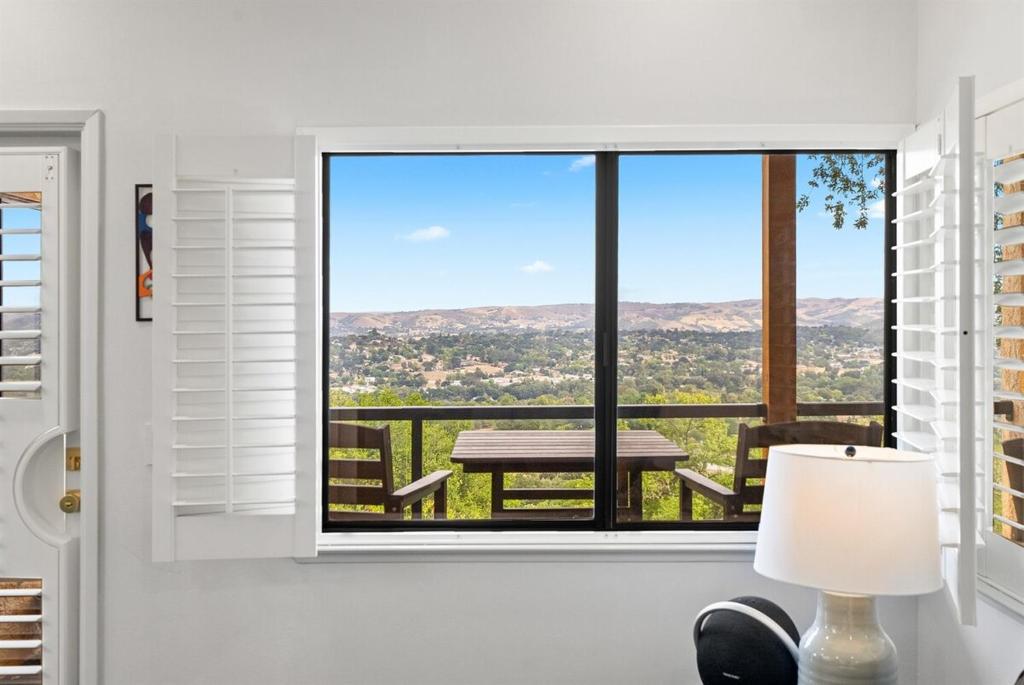 a room with a window with a table and a view at Mid-Mod Hilltop Retreat Views & Local Wildlife in Atascadero