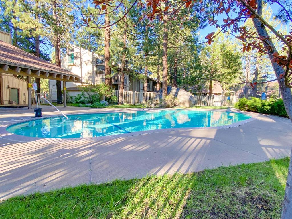 a swimming pool in the middle of a yard at Horizons 4 - Pool & Hot Tub Access in Mammoth Lakes