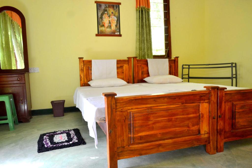 Postel nebo postele na pokoji v ubytování Sigiriya Freedom Lodge