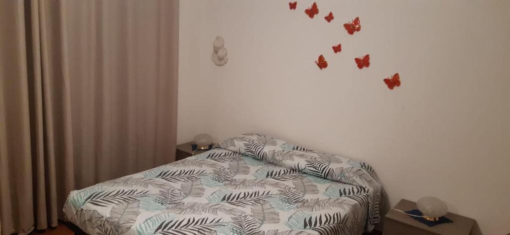 En eller flere senge i et værelse på Dimora Gundin