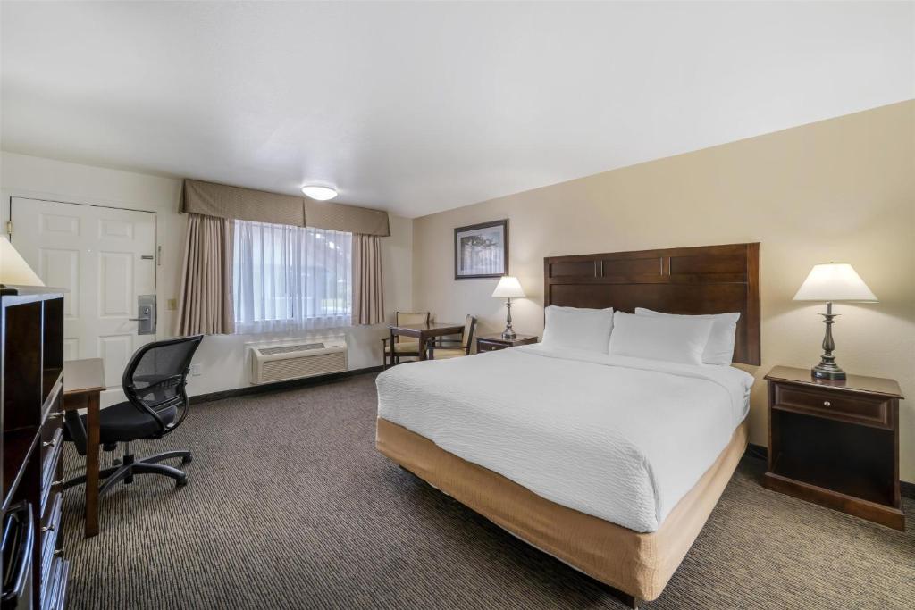 a hotel room with a bed and a desk at Best Western Arcata Inn in Arcata