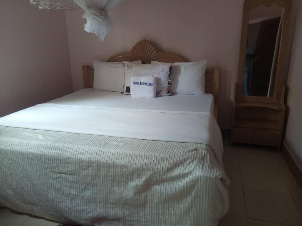 Postel nebo postele na pokoji v ubytování Gugga Resort Hotel