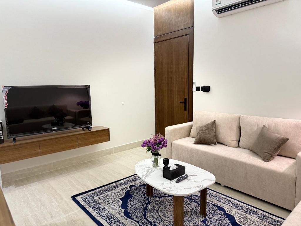 TV a/nebo společenská místnost v ubytování شقه مميزه و أجمل تصميم