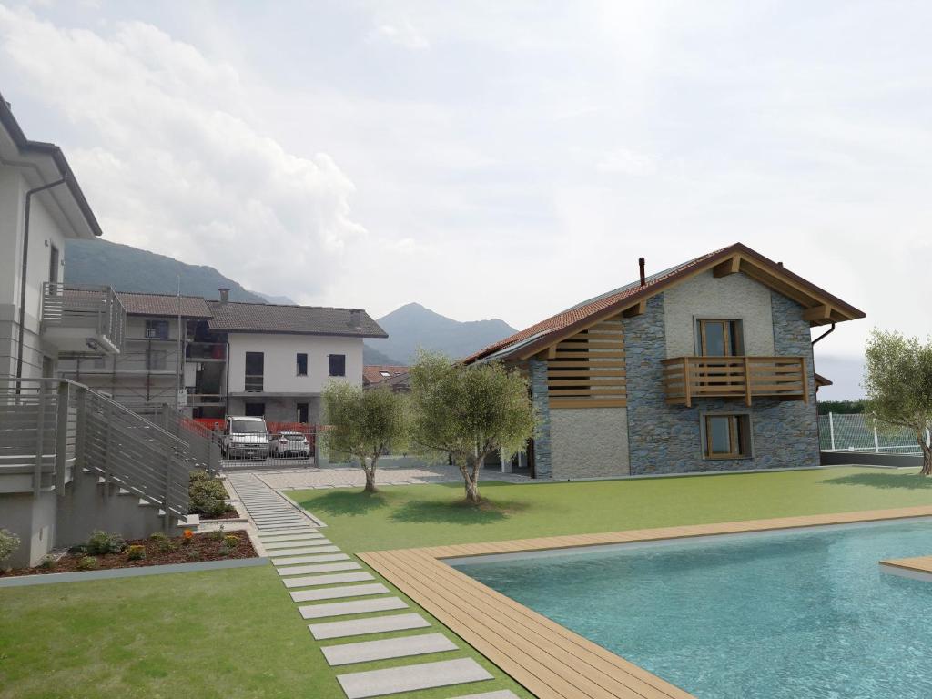 une villa avec piscine et une maison dans l'établissement Villa Sunset - Luxury property with pool & large private garden and parking, few steps from the beach, ideal for singles, couples and a family, à Dervio