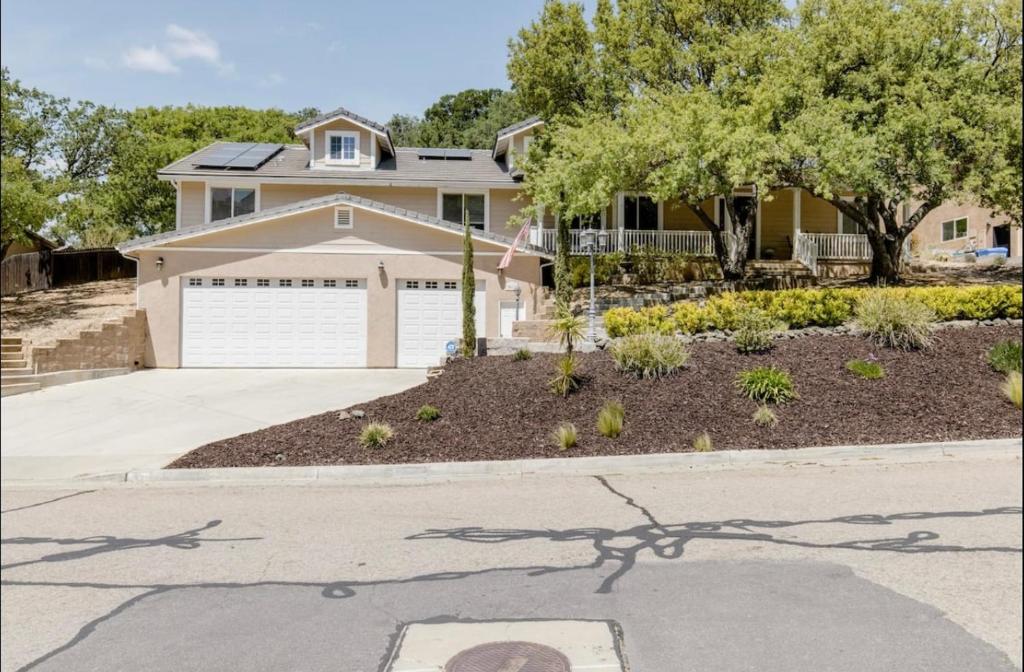 a house with a garage and a driveway at Red River Retreat in Capital Hill