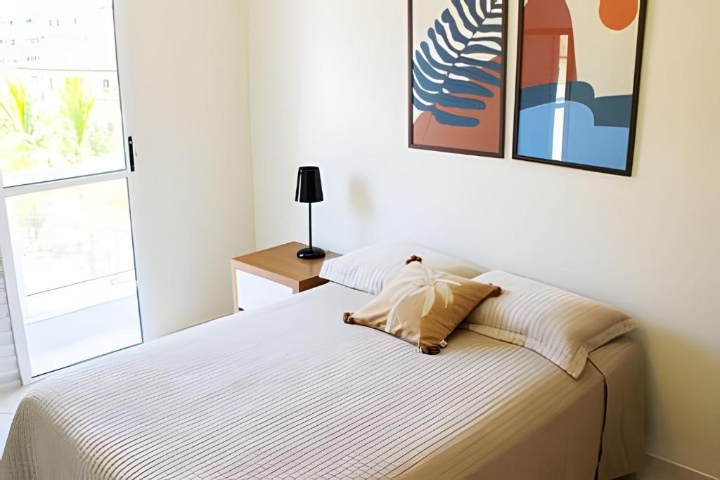 Postel nebo postele na pokoji v ubytování Condomínio Portinari