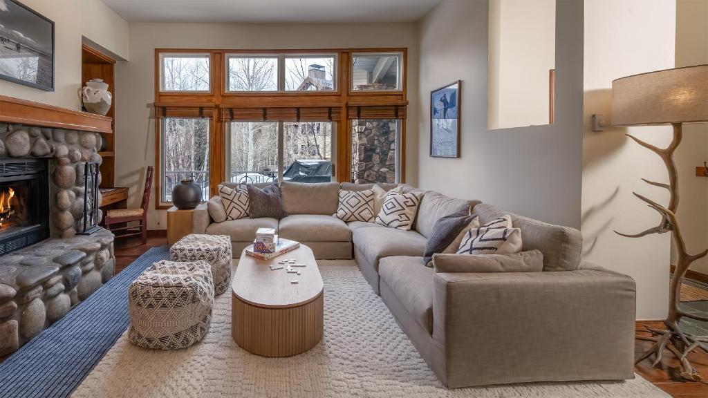 a living room with a couch and a fireplace at Chalet Verve in Beaver Creek